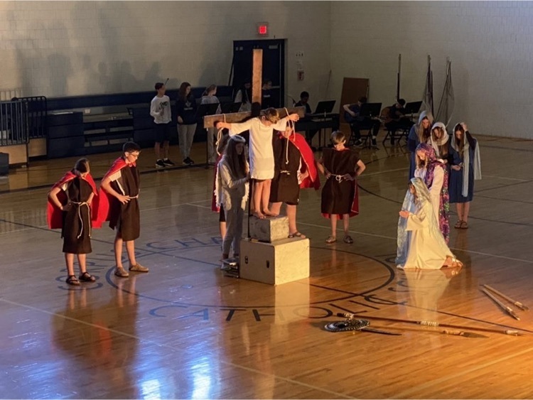 student portraying Jesus on the cross during living stations for Lent