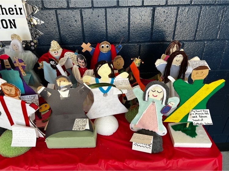 table of student created Saints made out of various materials 